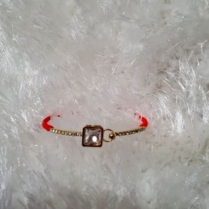 White House Black Market orange bracelet with gems